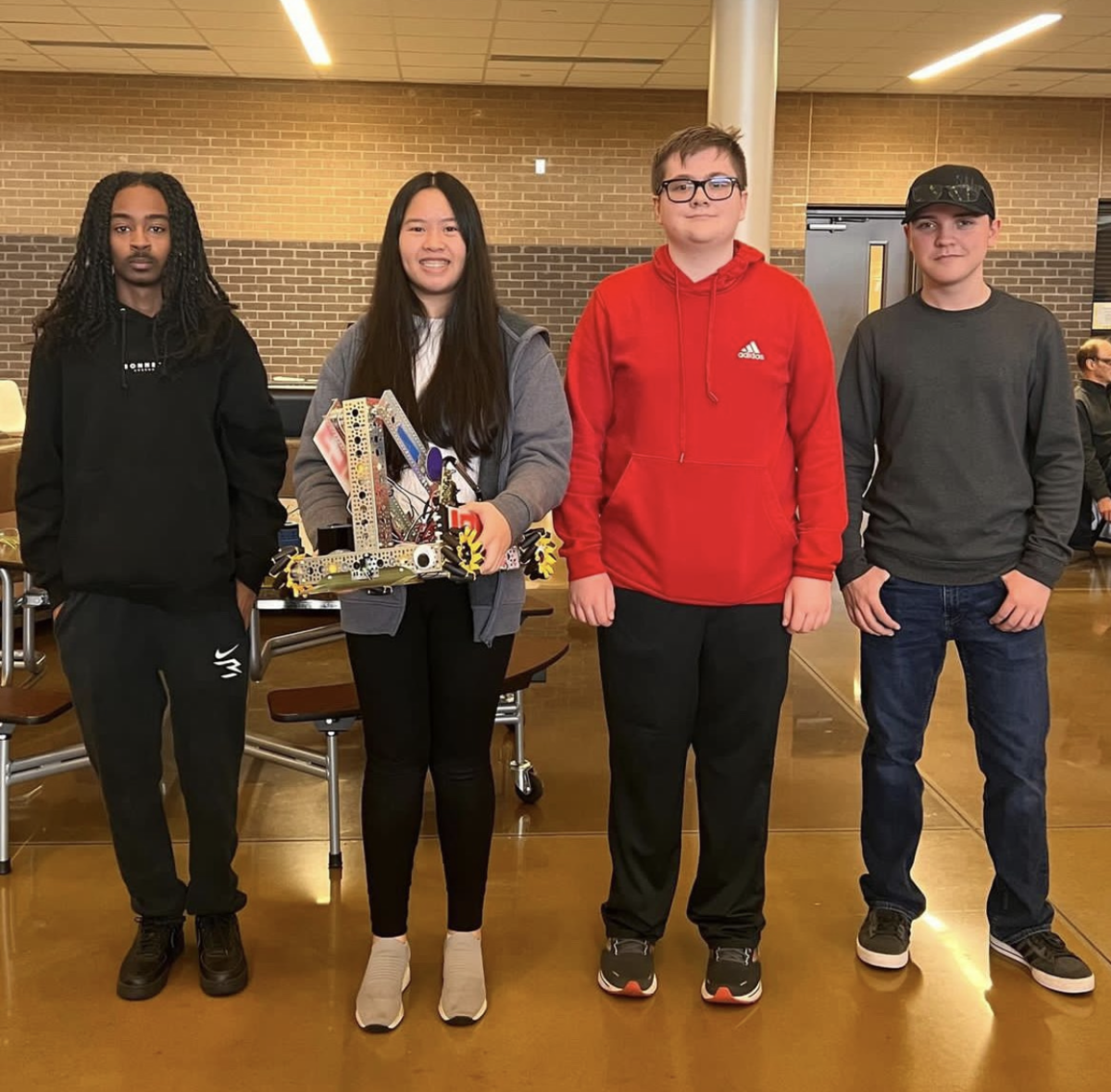 Students+in+Team+%2310123+with+their+robot+after+placing+fourth+in+their+competition.